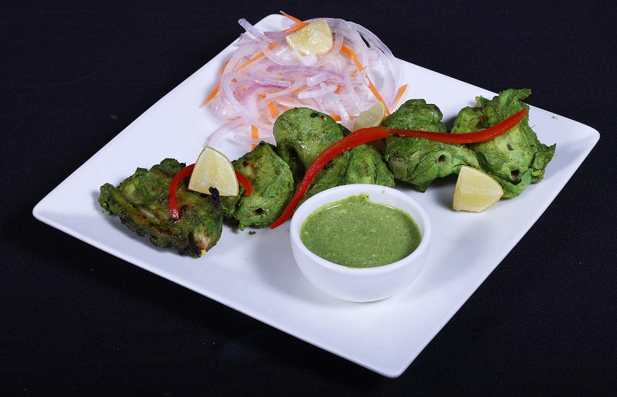 Green herb-marinated chicken tikka at Foyer